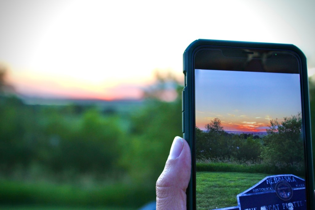 Phone Taking Picture of Sunset